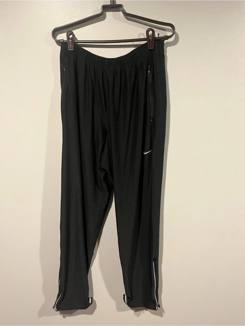 Nike Black Track Pants with White Swoosh and Ankle Zips